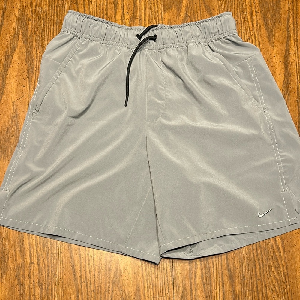 Nike DriFit shorts (or swim trunks). Men’s small